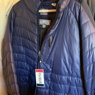 Clique navy blue lightweight puffer jacket with tags, featuring a zippered chest pocket and stand-up collar.