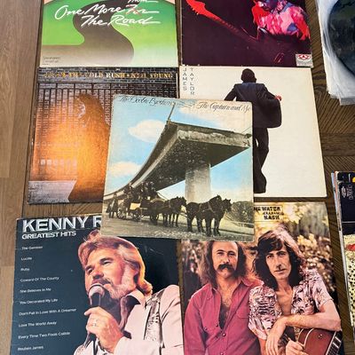 Collection of classic rock and country vinyl records, including albums by Lynyrd Skynyrd, Jimi Hendrix, Neil Young, James Taylor, The...