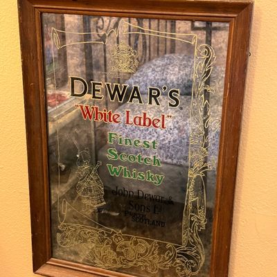 Vintage Dewar's "White Label" Finest Scotch Whisky advertising mirror in a simple wooden frame.