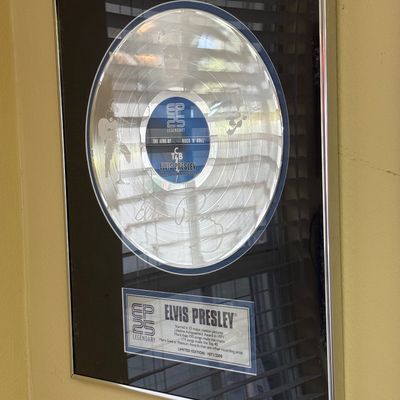 Framed Elvis Presley "EP 25 Legendary" limited edition commemorative platinum record award, numbered 1071 of 2500, featuring a...