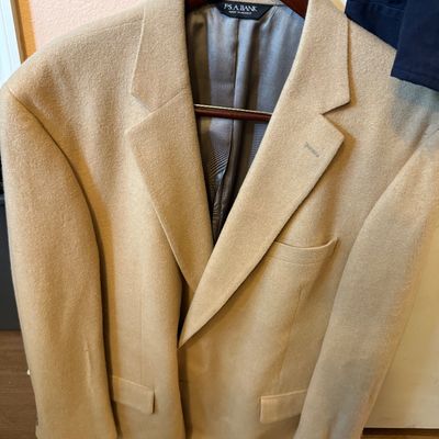 Jos. A. Bank camel hair sport coat in a classic tan color, featuring a notched lapel and fully lined interior.