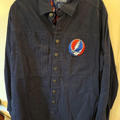 Grateful Dead x Section 119 navy blue button-down shirt featuring a Steal Your Face patch on the chest and a patterned collar lining.