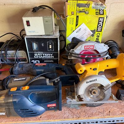 Assortment of used power tools and garage equipment, including a DeWalt circular saw, Ryobi hand vacuum, reciprocating saw, and battery...