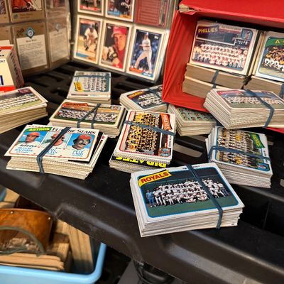 Large collection of vintage baseball cards, including rubber-banded stacks of team cards