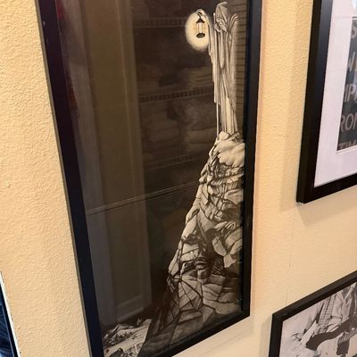 Framed Led Zeppelin "The Hermit" poster, depicting the iconic robed figure with a lantern atop a mountain, housed in a simple...