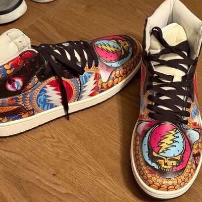 Custom Grateful Dead themed high-top sneakers featuring the iconic "Steal Your Face" skull logo and vibrant psychedelic artwork.
