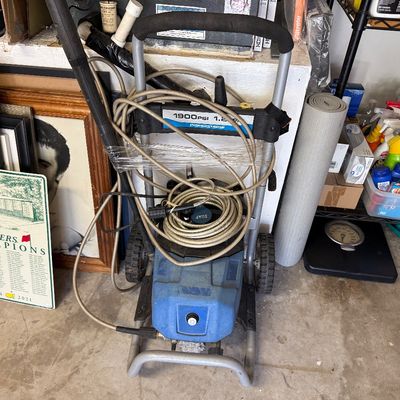 PowerStroke 1900 PSI electric pressure washer on a wheeled cart, shown with hose and spray wand.