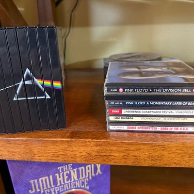 Pink Floyd "Shine On" CD box set alongside a stack of classic rock CDs including Pink Floyd, Creedence Clearwater Revival,...