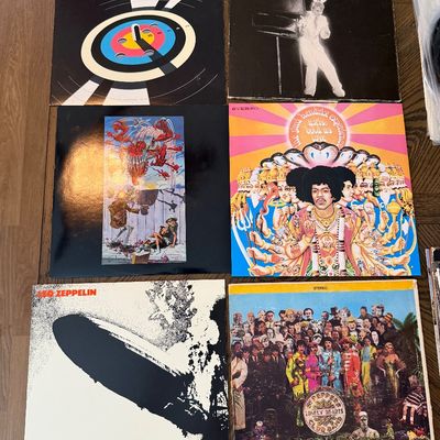 Collection of classic rock and comedy vinyl records, including albums by Led Zeppelin, The Beatles, Jimi Hendrix, and Steve Martin.