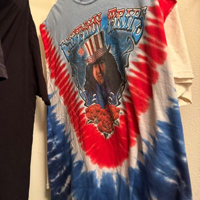 Vintage Grateful Dead "Captain Trips" tie-dye t-shirt featuring Jerry Garcia in an Uncle Sam hat.