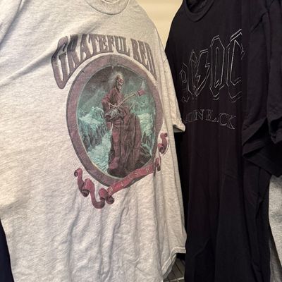Vintage-style band t-shirts featuring a grey Grateful Dead Alaska graphic tee and a black AC/DC Back in Black tee.