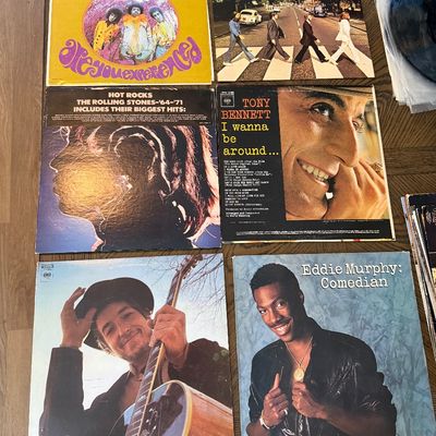 Collection of vintage vinyl records including albums by The Jimi Hendrix Experience, The Beatles, The Rolling Stones, Tony Bennett, Bob...