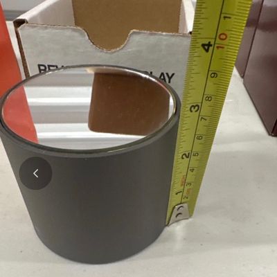 Rotating mirrored display stand for small figurine