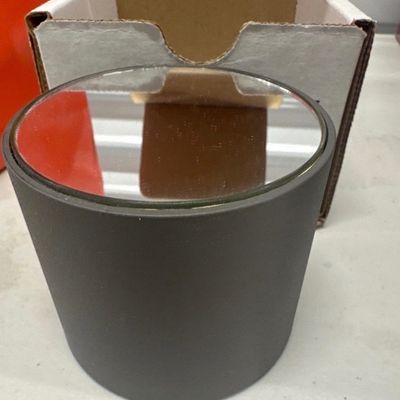 Rotating mirrored display stand for small figurine