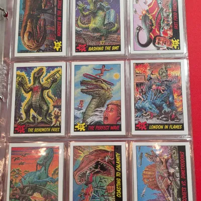 Sale Photo Thumbnail #11: Collection of vintage Dinosaurs Attack! trading cards by Topps, circa 1988, displayed in a plastic binder sleeve.