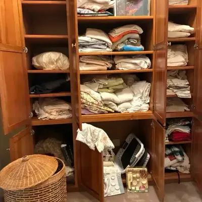 Linen Closet Contents with Wicker Basket