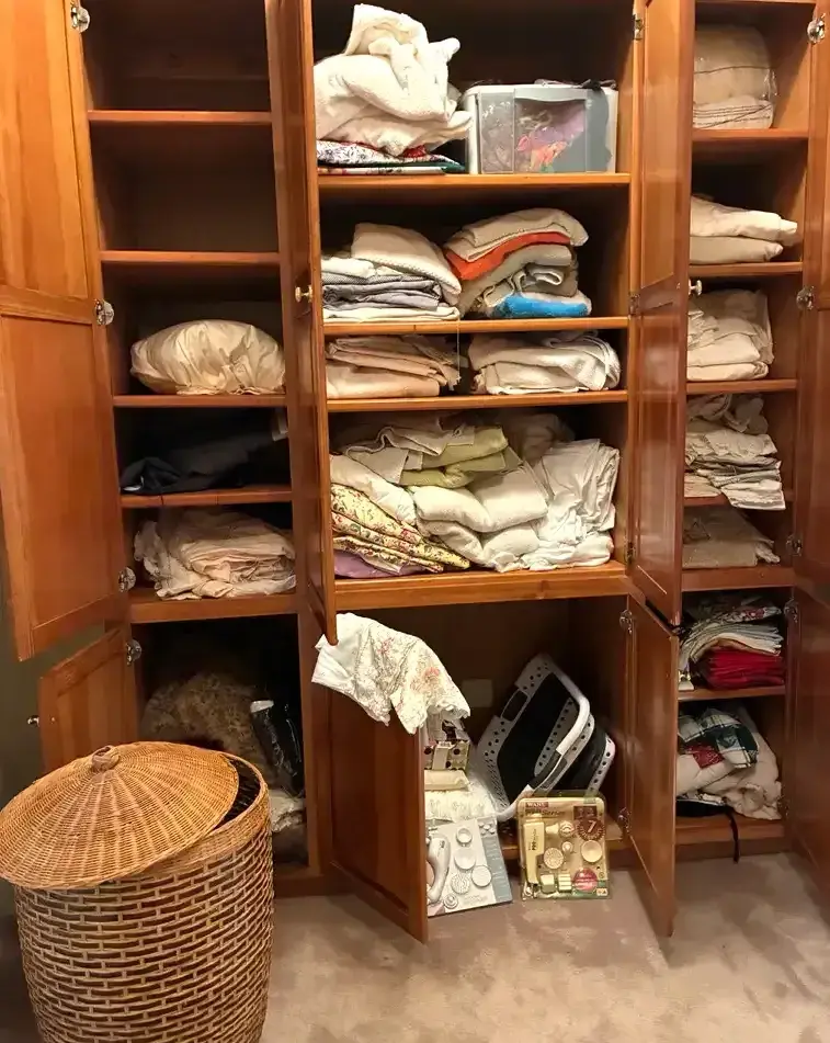 Linen Closet Contents with Wicker Basket