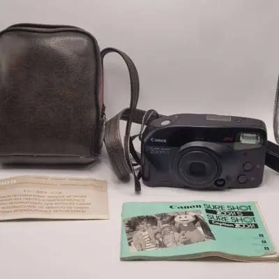 Canon Sure Shot Zoom-S 35mm Point & Shoot Film Camera with Leather Carrying Bag and Manual