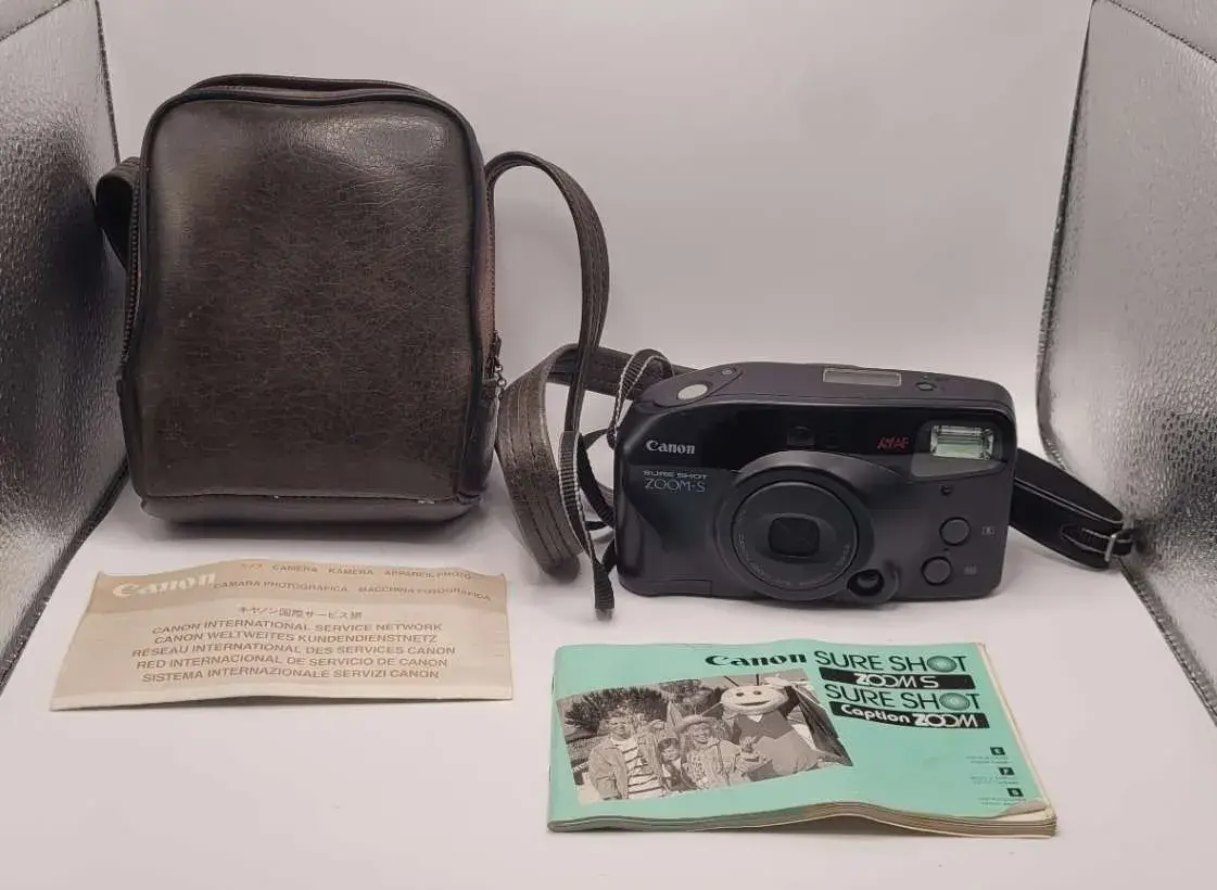 Canon Sure Shot Zoom-S 35mm Point & Shoot Film Camera with Leather Carrying Bag and Manual