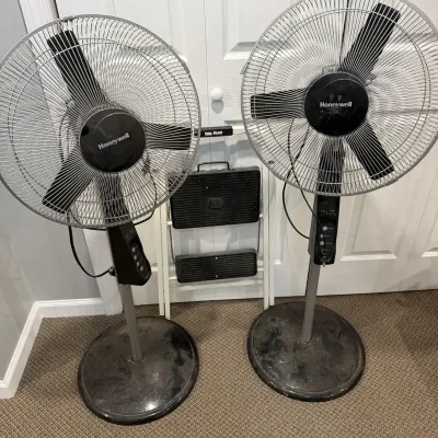 Two Honeywell Pedestal Fans and a Step Ladder