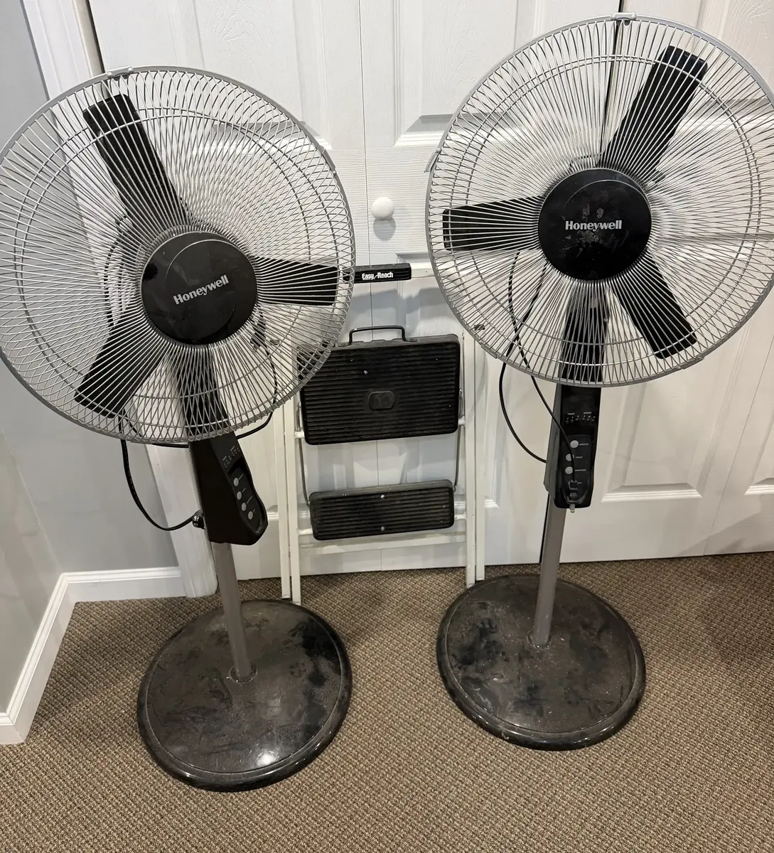 Two Honeywell Pedestal Fans and a Step Ladder