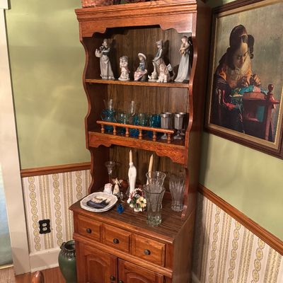 Vintage oak hutch featuring open shelving, three drawers, and a lower double-door cabinet, 