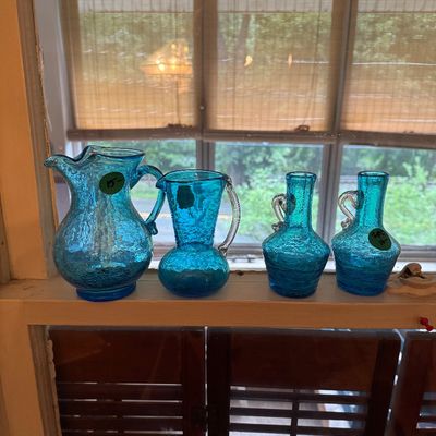 Collection of mid-century turquoise crackle glass pitchers and bud vases, 