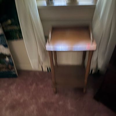 Vintage wooden two-tier telephone table or side table with a raised gallery edge on the top surface.
