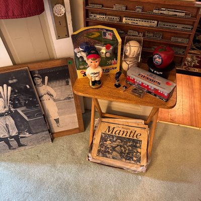 Collection of vintage baseball memorabilia, including framed black-and-white player photos, a Mickey Mantle newspaper, a bobblehead, and...
