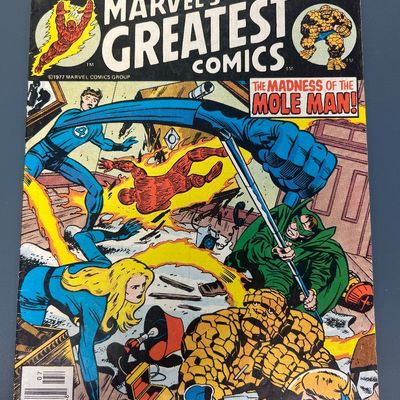 Sale Photo Thumbnail #81: Marvel's Greatest Comics #71 from July 1977, starring the Fantastic Four in "The Madness of the Mole Man!". Features classic cover art and a vintage Spalding Street Ball back cover advertisement featuring Rick Barry and Dr. J. The comic shows some light w