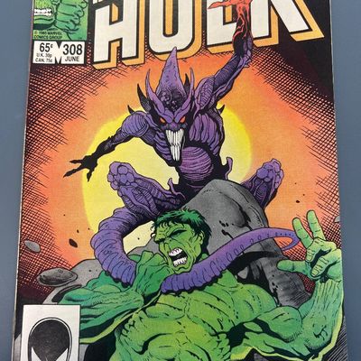 Sale Photo Thumbnail #59: Vintage Marvel comic book, The Incredible Hulk issue #308 from June 1985. Features cover art by Mike Mignola. The comic appears to be in good vintage condition with minor edge wear and light surface aging visible on the front and back covers. Back cover f