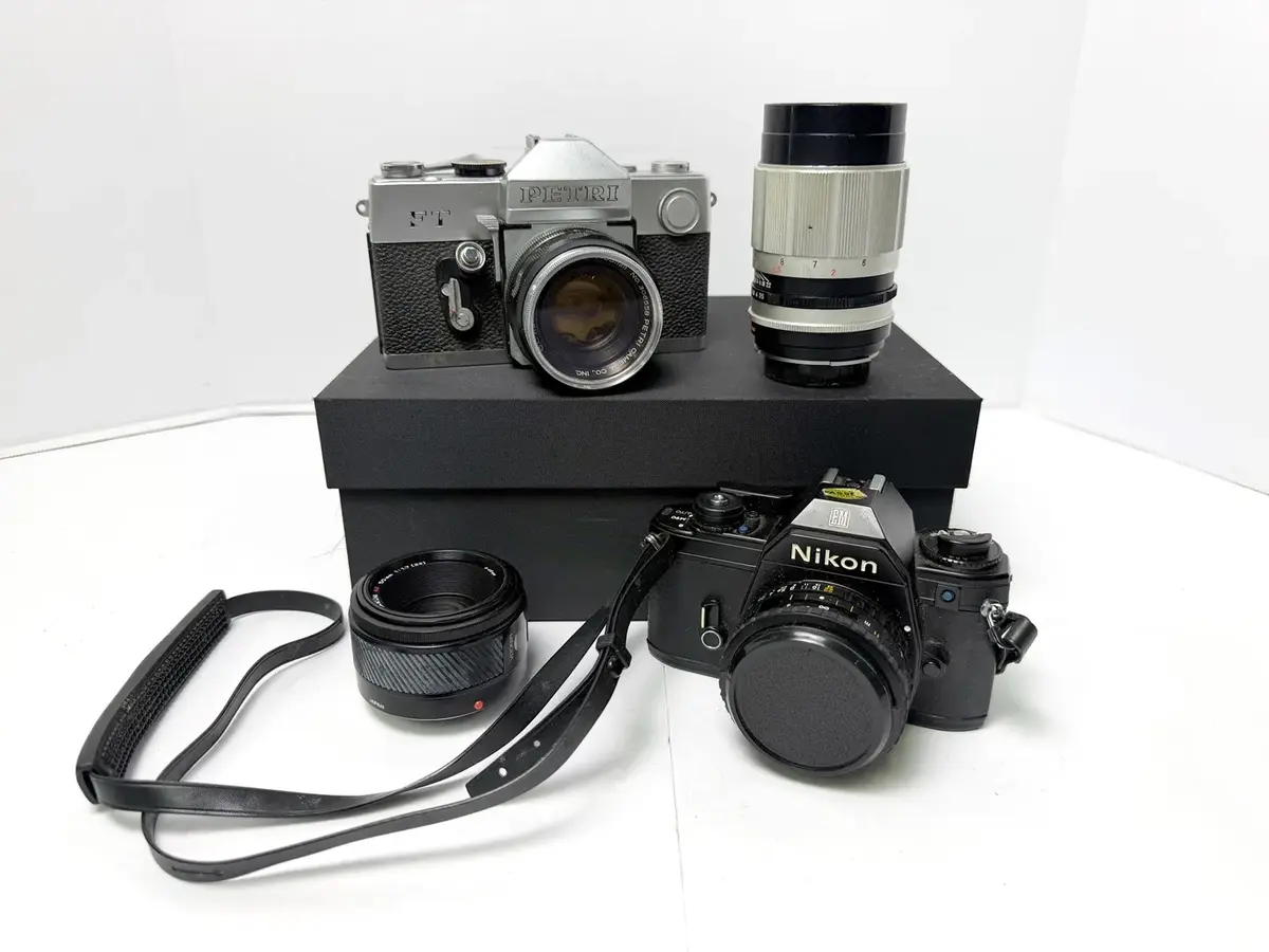 Nikon EM 35mm Camera with 50mm f1.8 Lens, Petri FT Camera with 2 Lenses & More