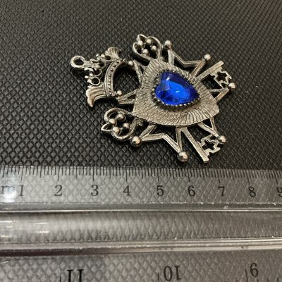 Silver-Tone Crest & Keys Pendant with Blue Rhinestone Heart