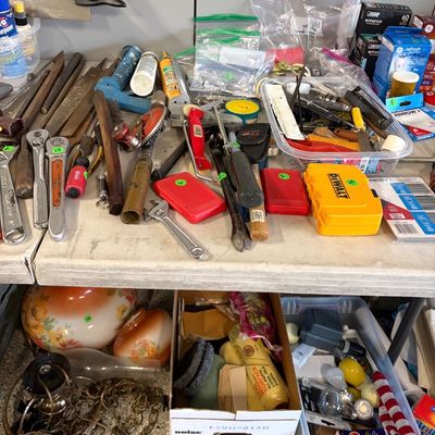 Sale Photo Thumbnail #81: Assortment of hand tools, hardware, and household items, including wrenches, files, a DeWalt case, and vintage glass lamp shades.