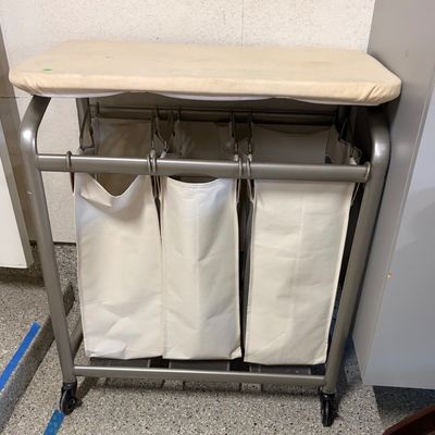 Sale Photo Thumbnail #79: Rolling laundry sorter cart with three removable canvas bags and an integrated padded ironing board top.