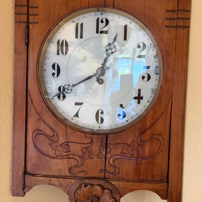 Sale Photo Thumbnail #31: Antique Art Nouveau carved wood wall clock featuring a white dial with large Arabic numerals and ornate black hands.over 100 yrs old