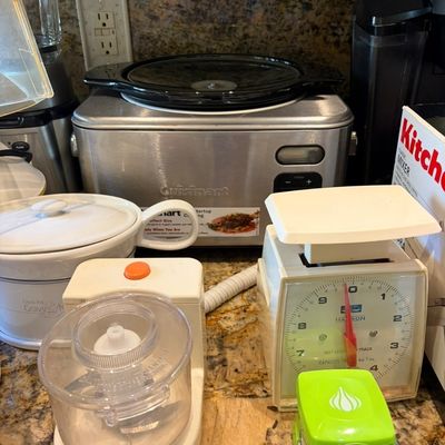Sale Photo Thumbnail #29: Assorted kitchen appliances including a stainless steel Cuisinart slow cooker, a Hanson kitchen scale, a mini food processor, and a Crock-Pot Gravy & More warmer.