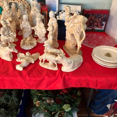 Sale Photo Thumbnail #94: Vintage Atlantic Mold ceramic nativity set with a light brown wash finish, displayed alongside Christmas plates and holiday decor.