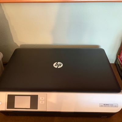 Sale Photo Thumbnail #84: HP Envy 5530 e-All-in-One printer, featuring print, scan, copy, and photo capabilities with a small color touchscreen display.