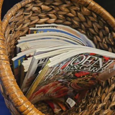Handwoven Antique Brown Basket With Handles And Several Phoenix Home Garden Magazines