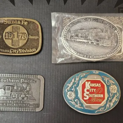 Collection of Four Vintage Railroad-Themed and Safety Award belt Buckles 