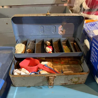 Vintage Union Steel Chest Corporation metal tackle box in distressed blue-gray finish, featuring a single cantilever tray with assorted...