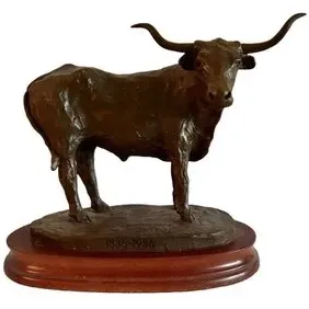 Bronze Texas Longhorn steer sculpture mounted on an oval wooden base, inscribed with the dates 1836-1986 to commemorate the Texas...