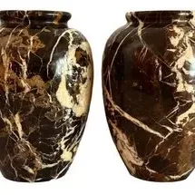 Pair of vintage polished marble vases featuring dramatic brown, cream, and white veining.