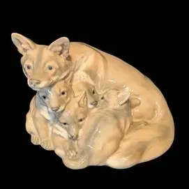 Royal Copenhagen Vixen and Kits Porcelain Figurine.  Vintage ceramic figurine depicting a mother dog or fox cradling her puppies,...