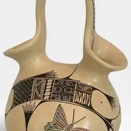 polychrome pottery wedding vase featuring hand-painted butterfly and geometric motifs, signed by the artist on the bottom.