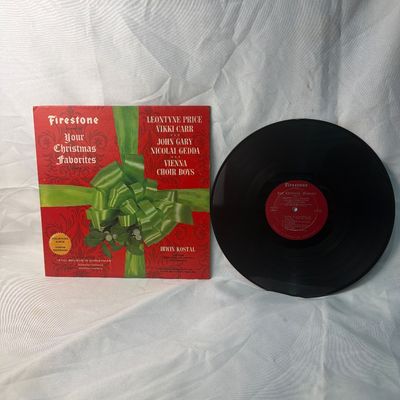 Sale Photo Thumbnail #70: Vintage 12-inch vinyl record album titled 'Firestone Presents Your Christmas Favorites Volume 7'. Features performances by Leontyne Price, Vikki Carr, John Gary, Nicolai Gedda, and the Vienna Choir Boys, conducted by Irwin Kostal. The cardboard sleeve sho