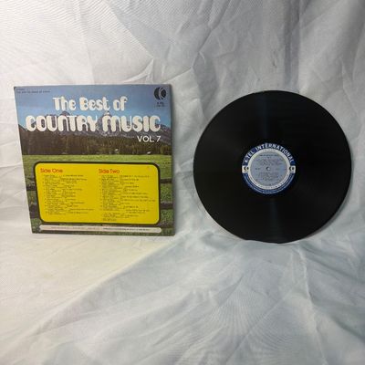 Sale Photo Thumbnail #64: Vintage vinyl record compilation album 'The Best of Country Music Vol. 7' released by K-Tel International (WU 325). Features 24 original hits by original stars including Johnny Cash, Donna Fargo, Hank Williams, Roy Clark, and Buck Owens. The cardboard sle