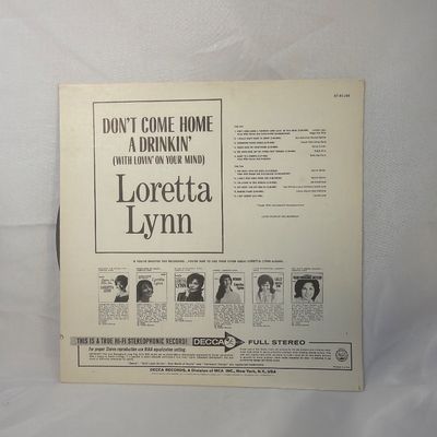 Sale Photo Thumbnail #4: Loretta Lynn - "Don't Come Home a Drinkin' (With Lovin' on Your Mind)" vinyl record album. Released on Decca Records (DL 74842) in stereophonic sound. Includes the original cardboard sleeve featuring cover art of Loretta Lynn. The vinyl disc shows some li