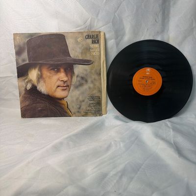 Sale Photo Thumbnail #51: Charlie Rich "Behind Closed Doors" vinyl record album on Epic Records. Includes the original gatefold jacket showing some shelf wear, edge wear, and light discoloration consistent with age. The vinyl record itself is included and features the orange Epic 